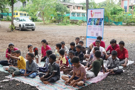Spreading Bliss Foundation team engaging with children during a health and education awareness session 

 
