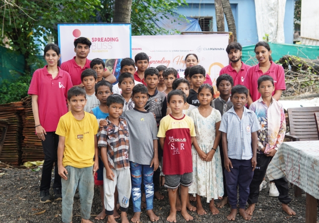 Spreading Bliss Foundation volunteers with underprivileged children at a community outreach session supporting child health and education in India
