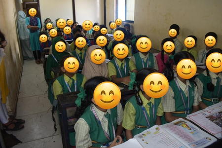 Underprivileged children in school uniforms attentively sitting in a classroom, representing the countless struggling families in India who fight every day to keep their children in school.
 




